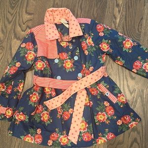Matilda Jane raincoat never worn.  Adorable rose and polka dot print. Size 6